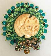 Cat and crystal button