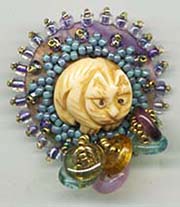 Cat and crystal button