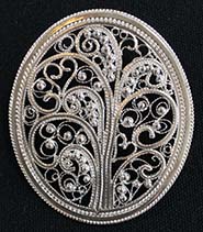 filigree oval button of a tree